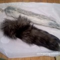 Faux fur and Crystal minx tail plug next to each other