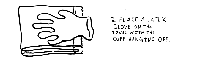 step-2-place-a-latex-glove-on-the-towel-with-the-cuff-hanging-off